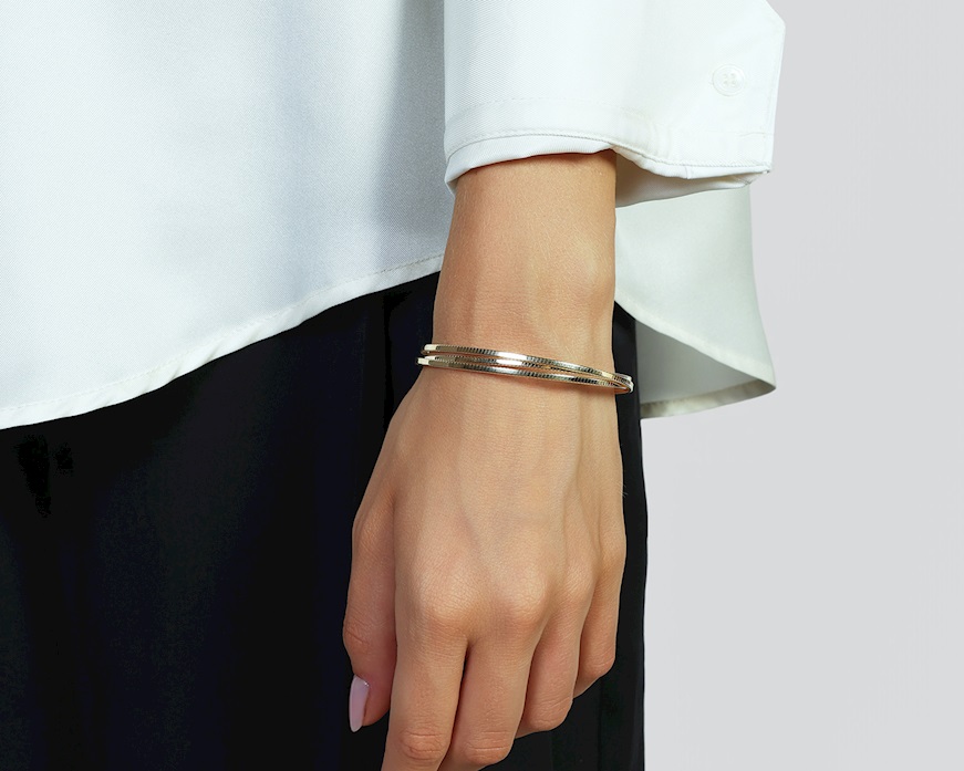 Bracciale argento dorato a tre fasce zigrinate Unoaerre